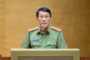 Bộ trưởng Lương Tam Quang trình bày tờ trình dự án Luật Phòng, chống mua bán người (sửa đổi)