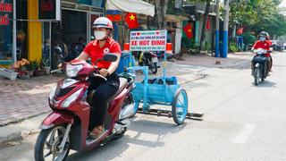 Những nữ hiệp sĩ kéo xe hút đinh ở Bình Dương